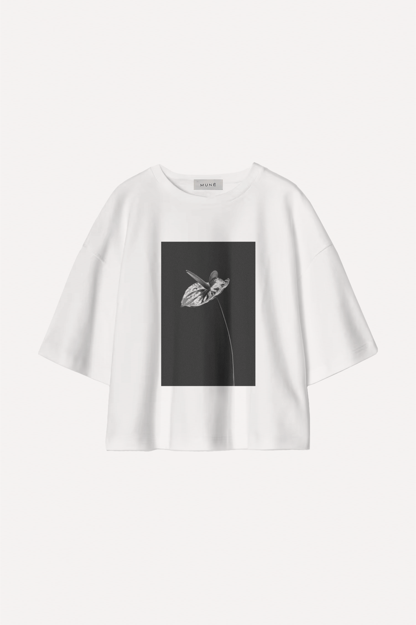 White t-shirt with a black graphic design on a white background